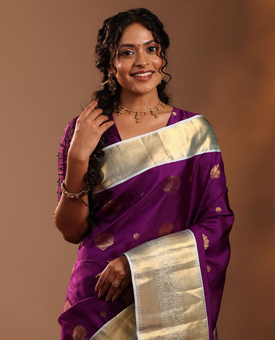 Purple Vasundhara Silk Saree Adorned with Zari Buttas, Enthralled with a Contrast Border of Mayil Kann, Mayil, and Rudraksham Designs, Complemented by a Pallu of Intricate Zari Designs, and Paired with a Contrast Blouse