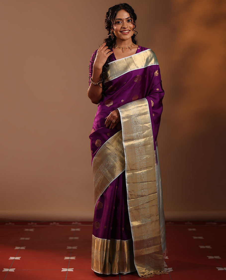 Purple Vasundhara Silk Saree Adorned with Zari Buttas, Enthralled with a Contrast Border of Mayil Kann, Mayil, and Rudraksham Designs, Complemented by a Pallu of Intricate Zari Designs, and Paired with a Contrast Blouse