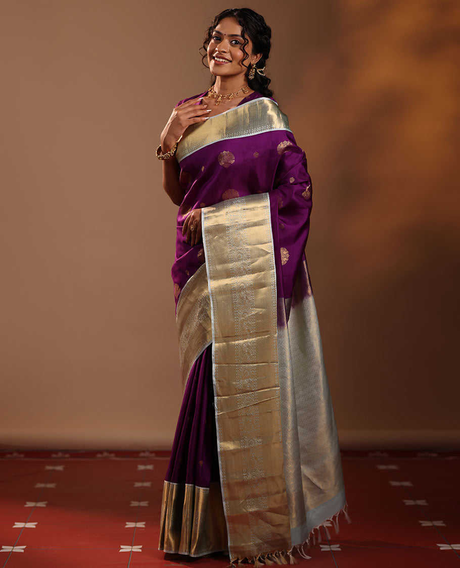 Purple Vasundhara Silk Saree Adorned with Zari Buttas, Enthralled with a Contrast Border of Mayil Kann, Mayil, and Rudraksham Designs, Complemented by a Pallu of Intricate Zari Designs, and Paired with a Contrast Blouse