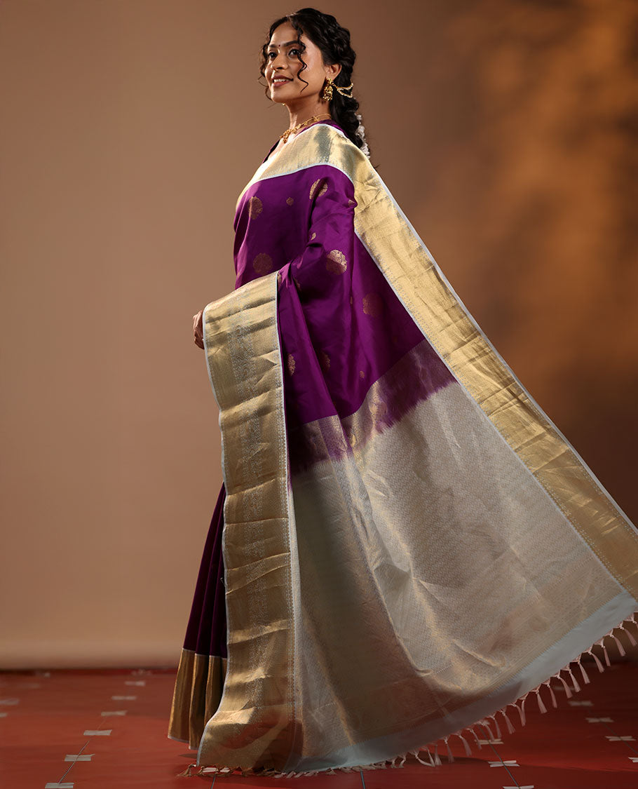 Purple Vasundhara Silk Saree Adorned with Zari Buttas, Enthralled with a Contrast Border of Mayil Kann, Mayil, and Rudraksham Designs, Complemented by a Pallu of Intricate Zari Designs, and Paired with a Contrast Blouse