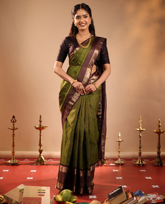 Green Vasundhara Silk Saree Mesmerized with Zari Micro-Checks All Over Its Body, Complemented by a   Contrast Border of Rekku, Kamalam, Mayil Kann, Yaanai and Mayil Designs, Subtly Sparkled Pallu of Jaal Designs, and Paired with a Contrast Blouse