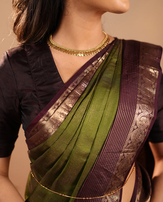 Green Vasundhara Silk Saree Mesmerized with Zari Micro-Checks All Over Its Body, Complemented by a   Contrast Border of Rekku, Kamalam, Mayil Kann, Yaanai and Mayil Designs, Subtly Sparkled Pallu of Jaal Designs, and Paired with a Contrast Blouse