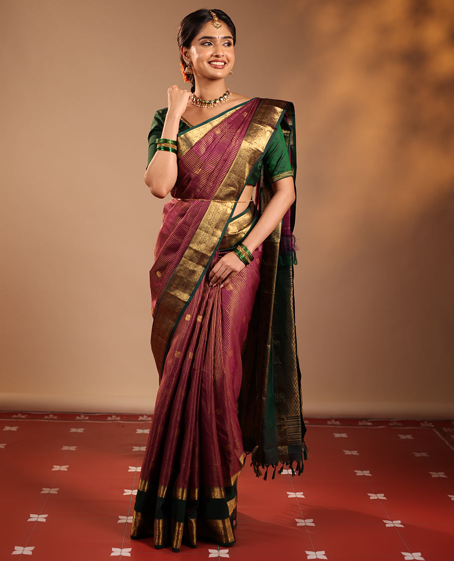 Magenta Vasundhara Silk Saree Featuring Zari Checks and Annam Chakram Buttas, Complemented by a Contrast Rettai Pettu Border with Muthu, Yaali, and Kodi Visiry Designs, a Jaal Pallu, and a Contrast Zari-Bordered Blouse