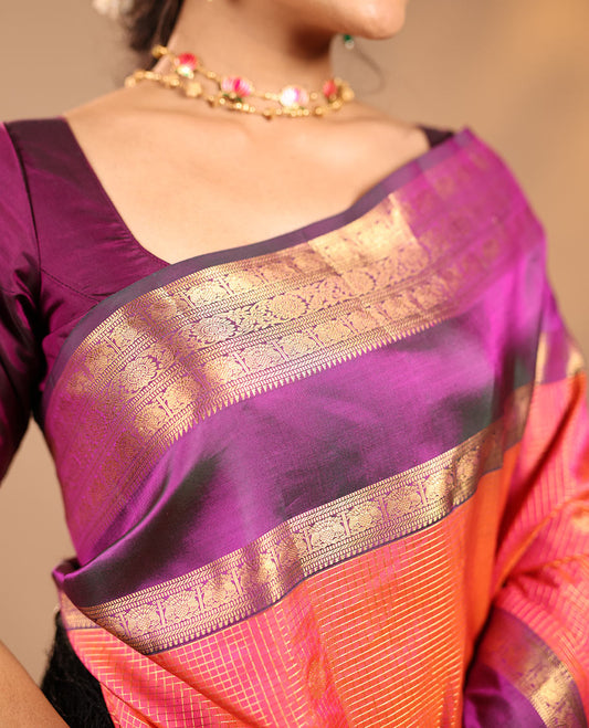 Orange Vasundhara Silk Saree Featuring Zari Checks and Annam Chakram Buttas, Complemented by a Contrast Rettai Pettu Border with Muthu, Yaali, and Kodi Visiry Designs, a Jaal Pallu, and a Contrast Zari-Bordered Blouse