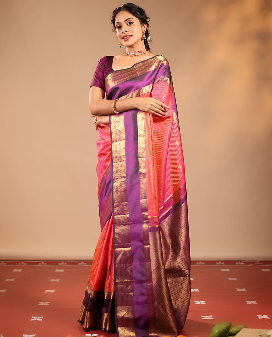 Orange Vasundhara Silk Saree Featuring Zari Checks and Annam Chakram Buttas, Complemented by a Contrast Rettai Pettu Border with Muthu, Yaali, and Kodi Visiry Designs, a Jaal Pallu, and a Contrast Zari-Bordered Blouse