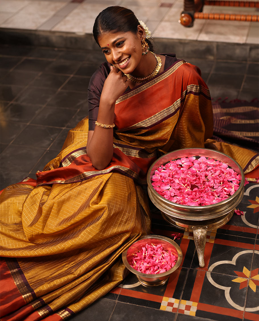 Mehendi Green Mayuri Soft Silk Saree Embellished with Medium-sized Zari Checks, Complemented by a Contrast Rettai Pettu Border of Rekku, Banaras, Kathir, and Star Vanki Designs, Pallu Elevated with Zari Designs, and Paired with a Contrast Blouse