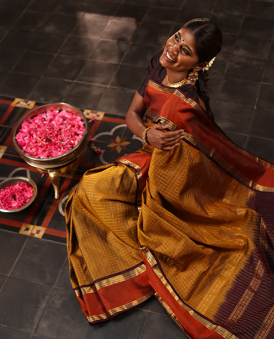 Mehendi Green Mayuri Soft Silk Saree Embellished with Medium-sized Zari Checks, Complemented by a Contrast Rettai Pettu Border of Rekku, Banaras, Kathir, and Star Vanki Designs, Pallu Elevated with Zari Designs, and Paired with a Contrast Blouse