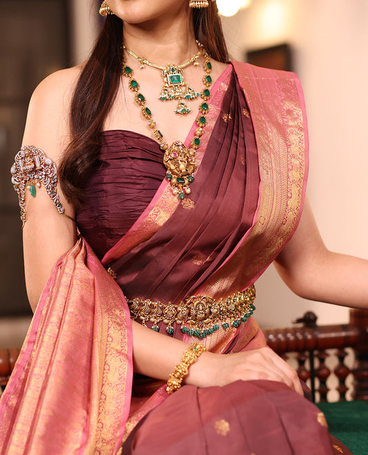 Brown Vasundhara Silk Saree Enriched with Zari Buttas, Complemented by a Contrast Border Featuring Auspicious Pichwai Cow Designs, Elevated with an Intricately Zari-Woven Pallu, and Paired with a Contrast Blouse