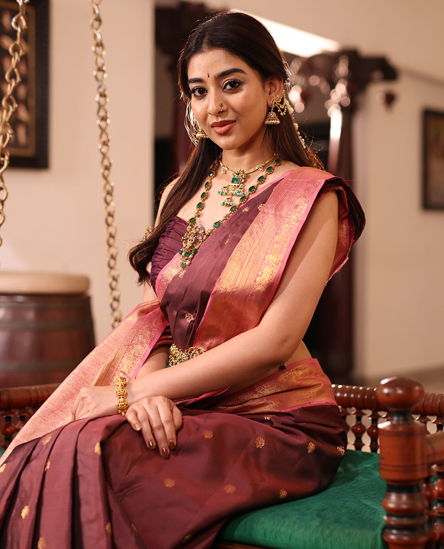 Brown Vasundhara Silk Saree Enriched with Zari Buttas, Complemented by a Contrast Border Featuring Auspicious Pichwai Cow Designs, Elevated with an Intricately Zari-Woven Pallu, and Paired with a Contrast Blouse