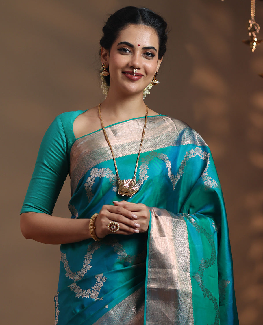 Peacock blue floral jaal jacquard Vasundhara silk mix saree, zari border of thilakam mokku, lavangam, and jaal designs, intricate pallu, and zari design blouse