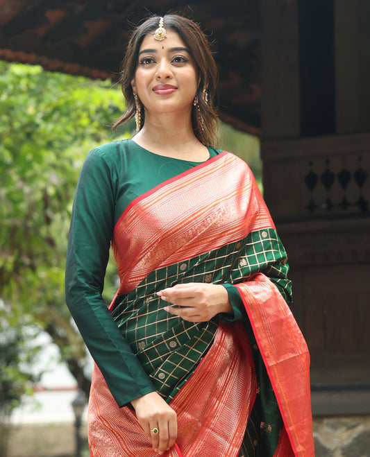 Green mayil chakram with zari checked Vasundhara silk saree, contrast intricate pallu, and border of thilakam mokku, diamond, and iruthalai pakshi designs