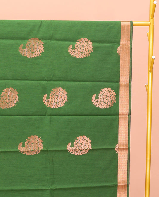 Green Semi-Silk Cotton Saree, Masterfully Woven with Paisley Zari Buttas All Over Its Body, Highlighted by a Zari Border, Pallu of Floral and Paisley Design, and Paired with a Matching Blouse