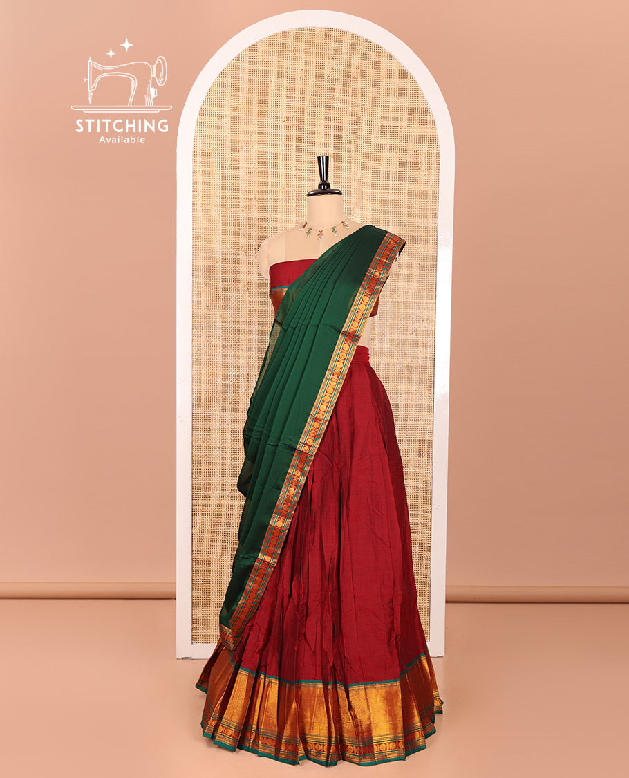 Maroon and Green Mercerised Cotton Half-Saree Featuring Plain Skirt, Adorned with a Contrast Peacock Eye-Rudraksham Motifs Woven Zari Border, Paired with a Matching Blouse, and Contrast Syska Georgette Dhavani with Zari Border