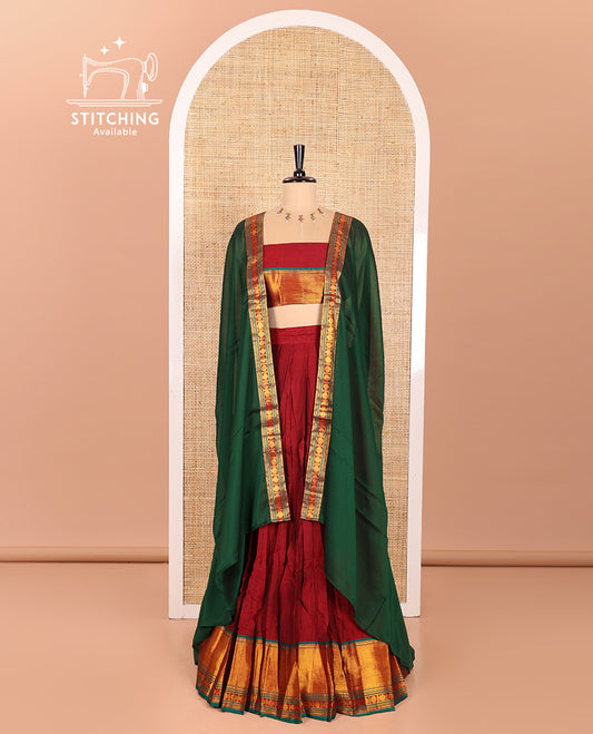 Maroon and Green Mercerised Cotton Half-Saree Featuring Plain Skirt, Adorned with a Contrast Peacock Eye-Rudraksham Motifs Woven Zari Border, Paired with a Matching Blouse, and Contrast Syska Georgette Dhavani with Zari Border