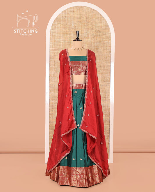 Dark Green and Red Semi-Banarasi Half-Saree, Adorned with Zari Buttas on Its Skirt, Complemented by a Contrast Traditional Zari Design Woven Border, Paired with a Matching Blouse, and a Contrast Satin Georgette Embroidered Scallop Dhavani