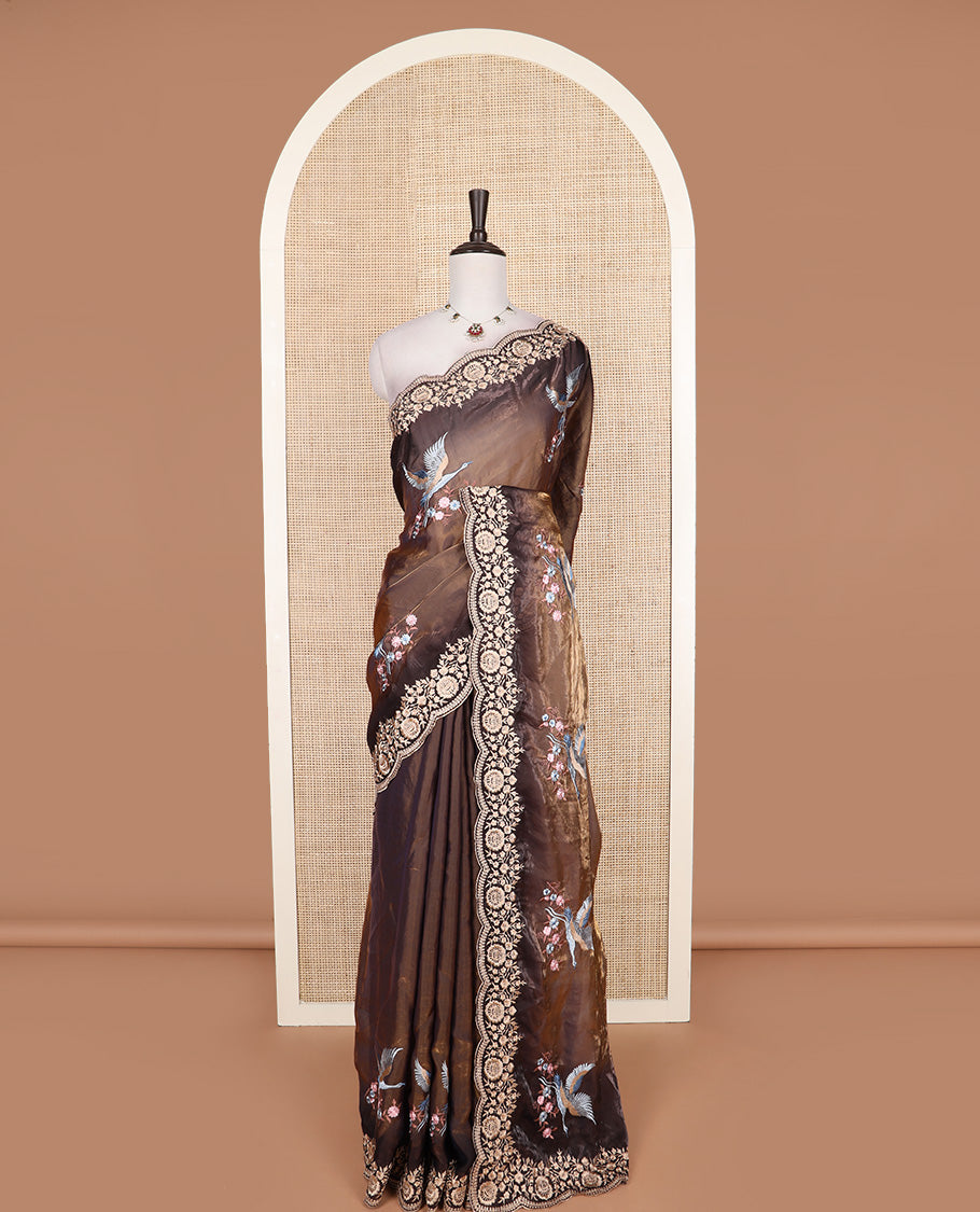 Brown crane and floral motifs thread embroidered designer saree, scallop floral thread embroidered border, and embroidered pallu