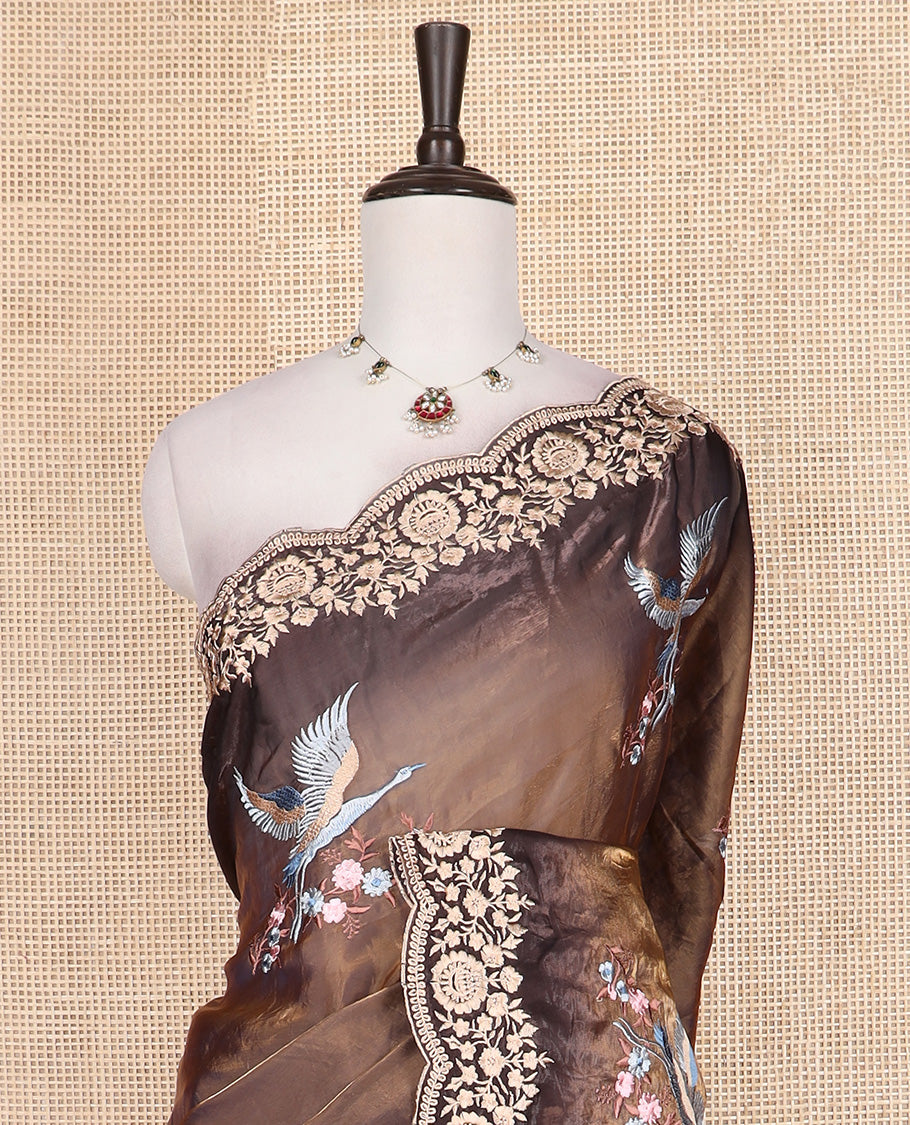 Brown crane and floral motifs thread embroidered designer saree, scallop floral thread embroidered border, and embroidered pallu