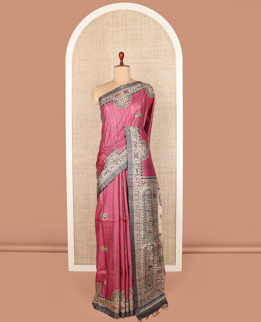 Pink warli printed tussar saree, contrast warli printed border, and pallu of warli motifs print