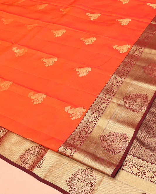 Orange Vasundhara Lite Silk Mix Saree, Accentuated With Zari Buttas All Over Its Body, Complemented by Captivating Contrast Border of Traditional Zari Designs, Grand Pallu of Jaal Designs and Paired with a Contrast Blouse