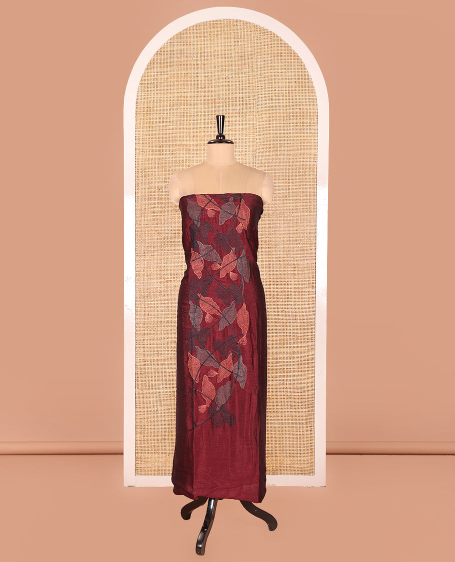 Maroon Vichitra Silk Designer Material Chudidar Set, Elegantly Detailed with Floral Cross-Stiched Embroidered Top, A Subtly Plain Santoon Bottom, and Paired with a Georgette Abstract Printed Dupatta