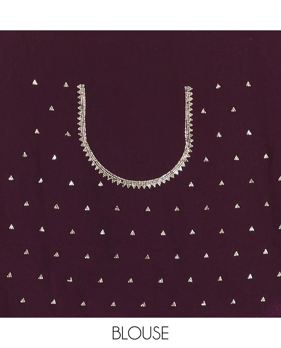 Wine micro-stone work fendy chiffon saree with paisley stone work on its shoulder, a scallop stone work border, a butterfly style pallu, and a matching stone work blouse