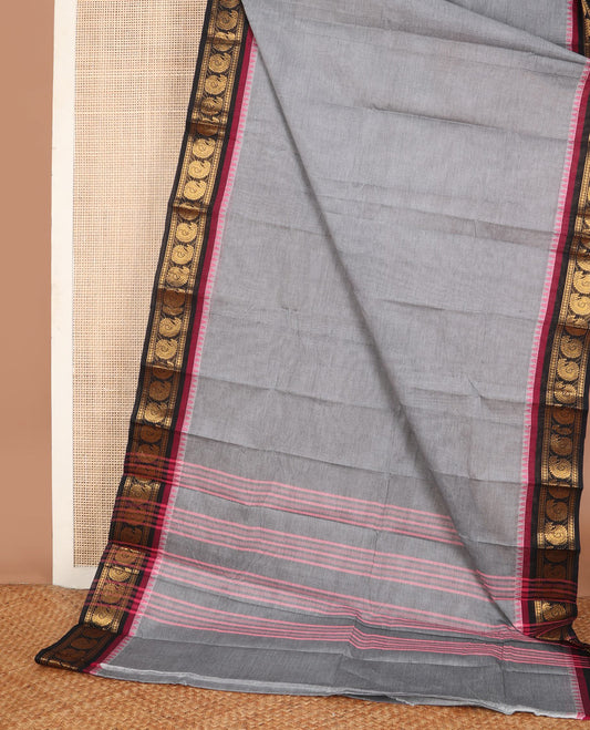 Grey plain Chettinad cotton saree, contrast temple border of zari manga motifs & pink thread striped pallu