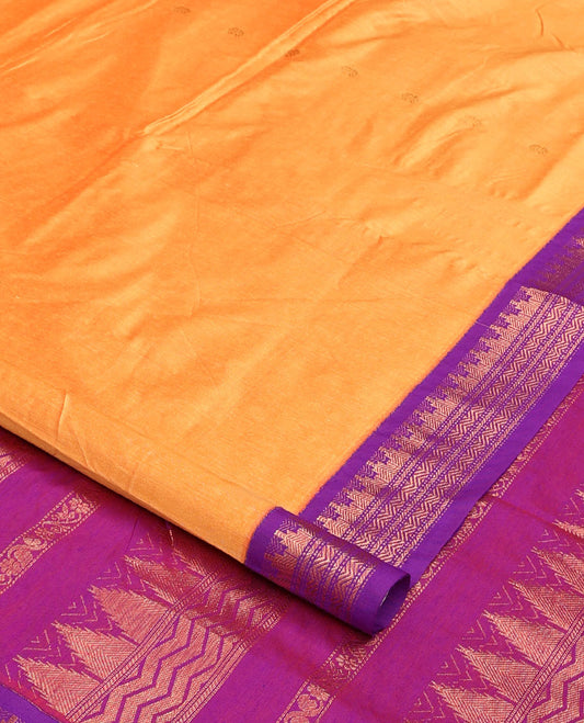 Orange buttas nine-yard cotton saree, contrast traditional zari border, and pallu steeped with traditional designs