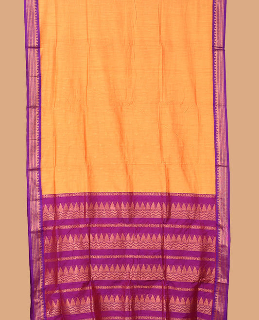 Orange buttas nine-yard cotton saree, contrast traditional zari border, and pallu steeped with traditional designs