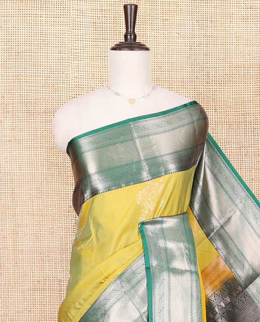 Green Budget Silk Saree, Gracefully Embellished with Zari Buttas All Over Its Body, Complemented by a Contrast Traditional Zari Design Border, Chevron Striped Pallu, and Paired with a Contrast Blouse