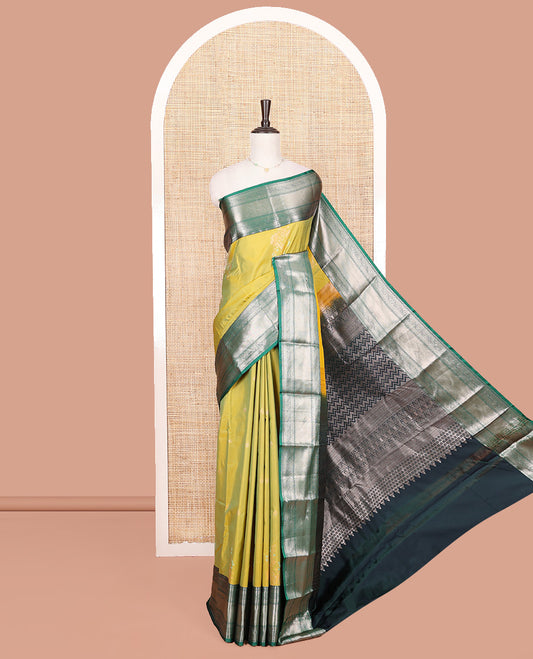 Green Budget Silk Saree, Gracefully Embellished with Zari Buttas All Over Its Body, Complemented by a Contrast Traditional Zari Design Border, Chevron Striped Pallu, and Paired with a Contrast Blouse