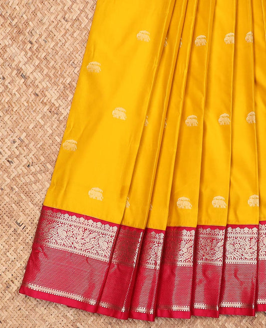 Yellow elephant motifs gift saree, contrast traditional zari design border, and intricate pallu