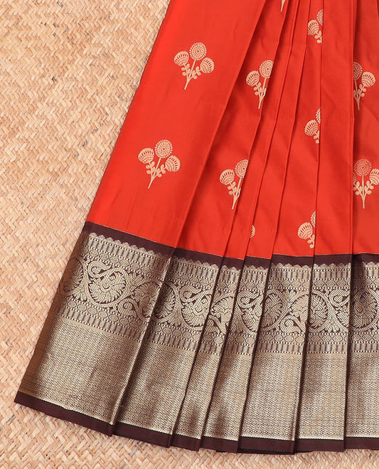 Orange floral buttas budget silk saree, contrast traditional zari design border, and pallu of floral motifs