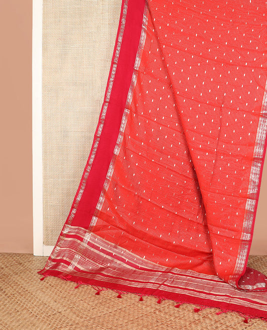 Red buttas and striped assam silk saree, contrast traditional zari border, and pallu of zari stripes