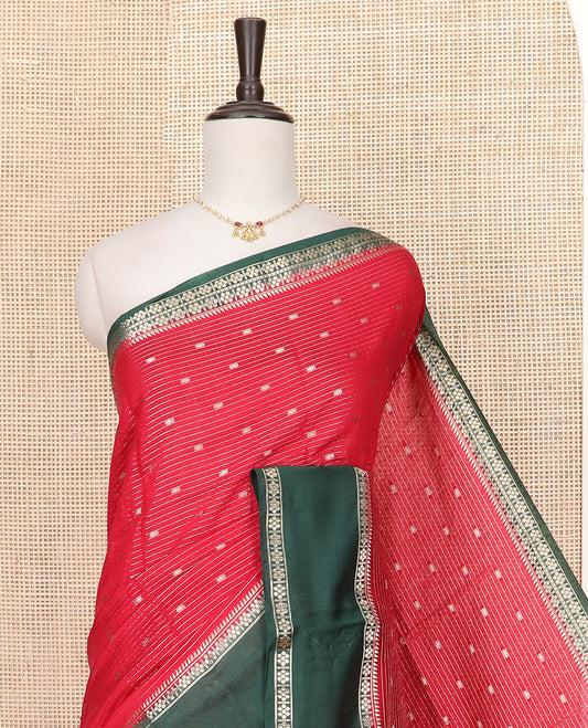 Red Assam Silk Saree Enlivened with Zari Buttas and Stripes, Complemented by a Contrast Traditional Zari  Design Border, a Captivating Pallu Featuring Zari Designs, and Paired with a Contrast Blouse