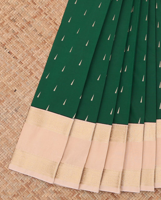 Green Budget Silk Saree Beautified with Buttas, Highlighted with a Contrast Traditional Zari Design Rettai Pettu Border, Subtly Woven Pallu of Geometric Patterns, and Paired with a Contrast Blouse