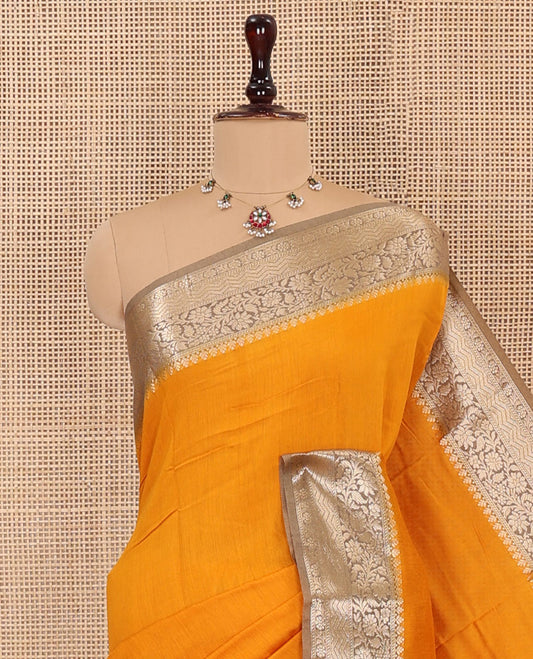 Orange Plain Assam Silk Saree, Complemented by Captivating Contrast Border of Floral Creeper Zari Designs, Zari Striped Pallu, and Paired with a Contrast Blouse