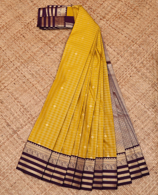 Yellow Budget Silk Saree, Mesmerized with Zari Buttas and Checks All Over Its Body, Complemented by a Contrast Traditional Zari Design Border of Peacocks, Opulently Embellished Pallu, and Paired with a Contrast Blouse