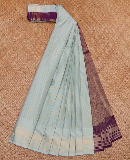 Pale Green Budget Silk Saree, Subtly Sparkled With Buttas All Over Its Body, Highlighted by Zari Border, Contrast Grand Pallu and Paired with a Contrast Blouse