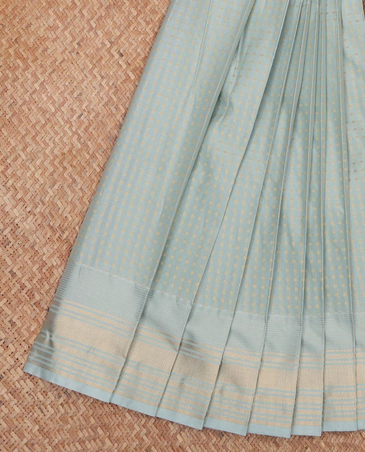 Pale Green Budget Silk Saree, Subtly Sparkled With Buttas All Over Its Body, Highlighted by Zari Border, Contrast Grand Pallu and Paired with a Contrast Blouse