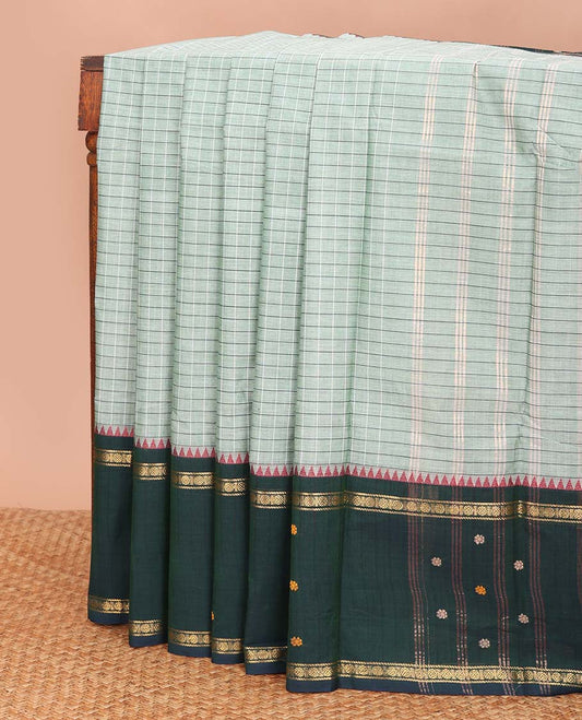 Navy blue checked chettinad cotton saree, contrast ganga jamuna temple border of flower motifs, and striped pallu
