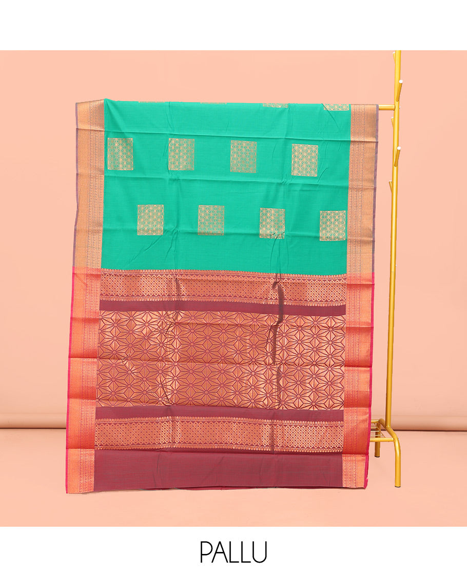 Green Semi-Silk Cotton Saree, Charmingly Accented with Zari Buttas All Over Its Body, Complemented by a Contrast Traditional Zari Design Border, Pallu of Star Design, and Paired with a Contrast Blouse