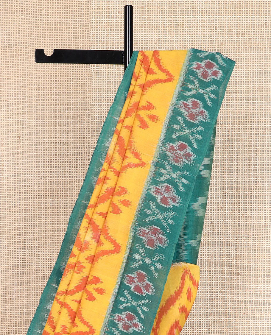 Yellow ogee-patterned ikkat cotton saree, contrast cross & floral motifs ikat border & ikkat design pallu