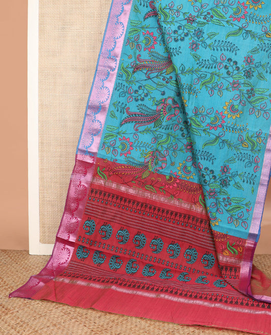 Blue kalamkari style floral vine and peacock printed Andhra cotton saree, rose copper zari floral border, and printed pallu