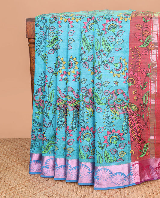 Blue kalamkari style floral vine and peacock printed Andhra cotton saree, rose copper zari floral border, and printed pallu