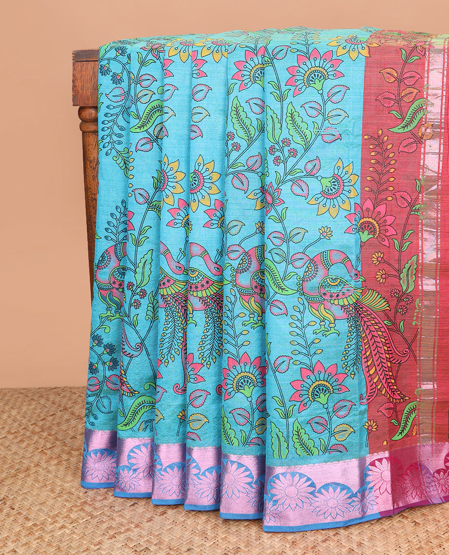 Blue kalamkari style floral vine and peacock printed Andhra cotton saree, rose copper zari floral border, and printed pallu