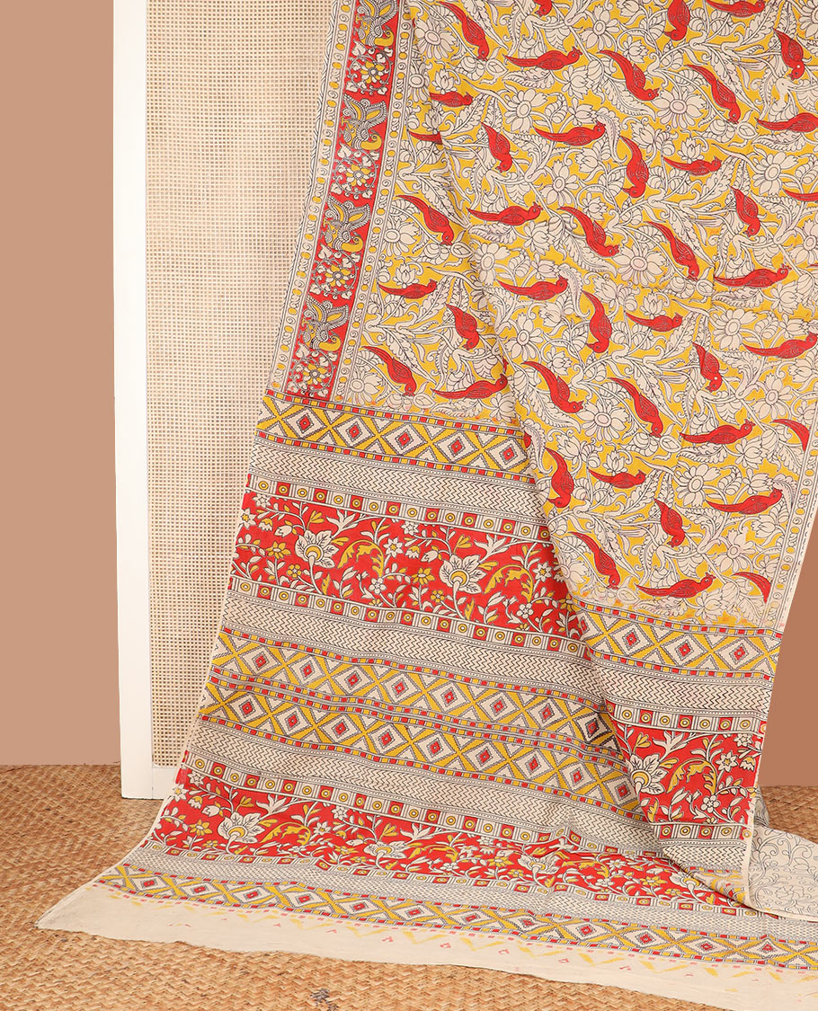 Yellow floral vine and bird machine-printed Kalamkari cotton saree, contrast peacock border, and pallu of floral-geometric designs