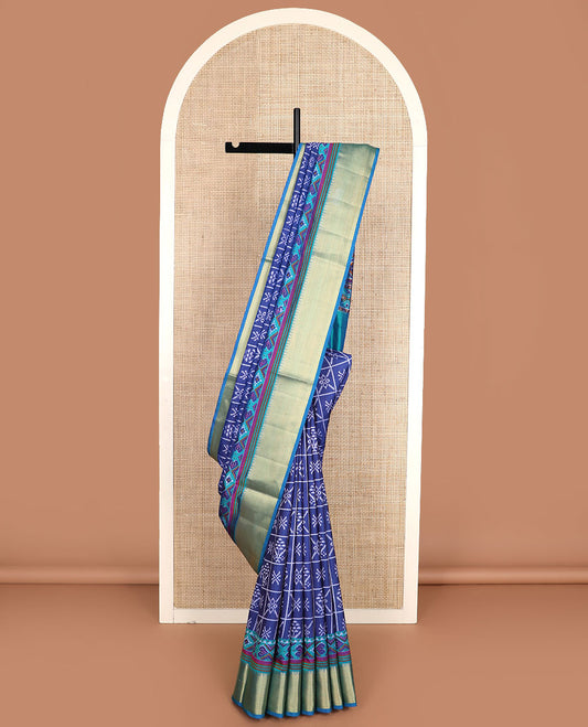 Navy blue butta enclosed checked semi-banaras patola silk saree, contrast temple zari border of ikkat design, and pallu steeped with geometric patterns