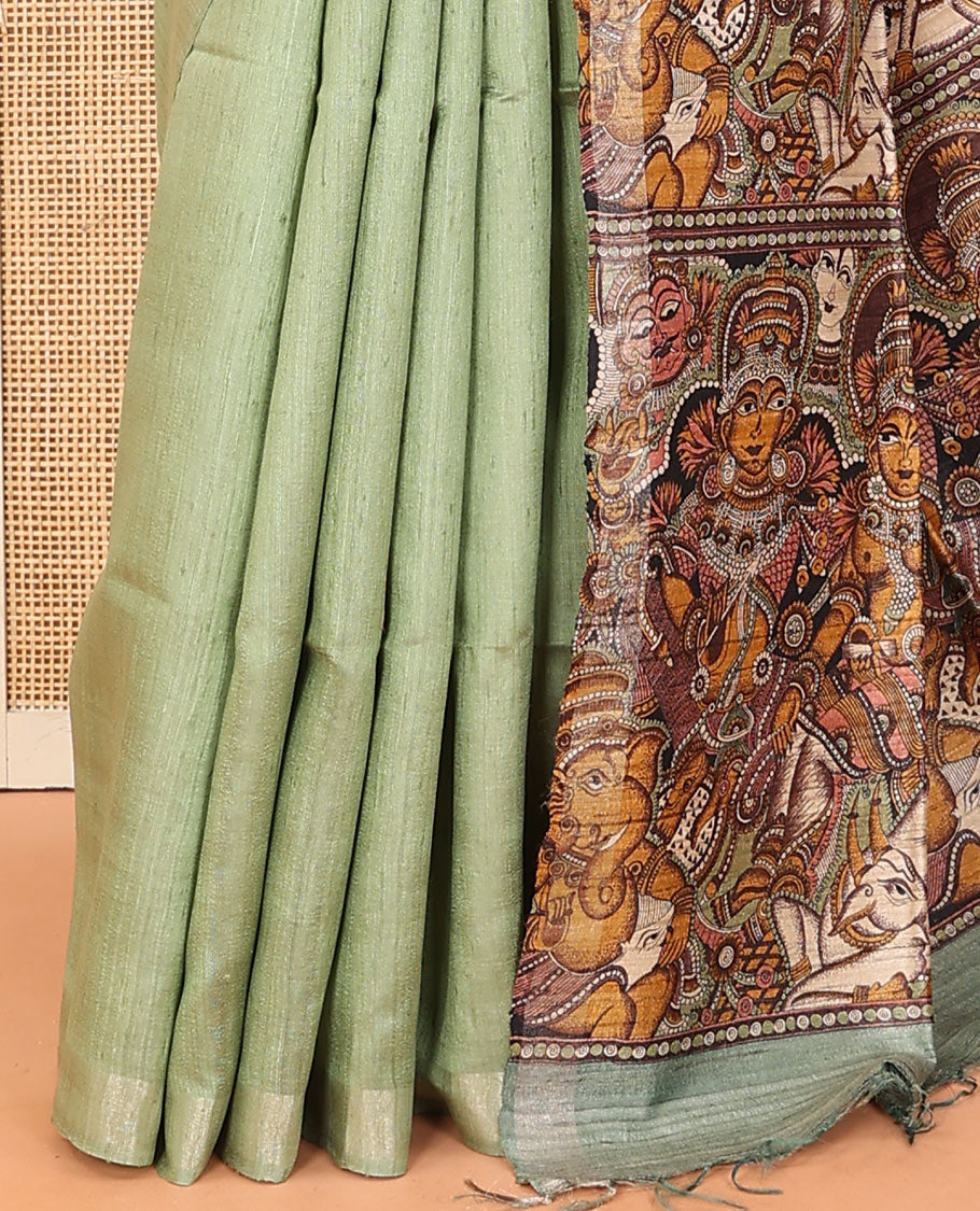 Pista green plain dupion saree, zari border, and contrast pallu of god and goddess figurines print