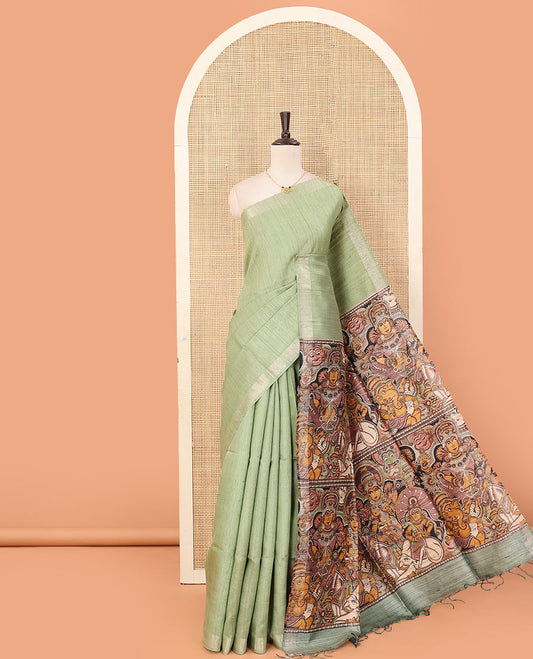 Pista green plain dupion saree, zari border, and contrast pallu of god and goddess figurines print