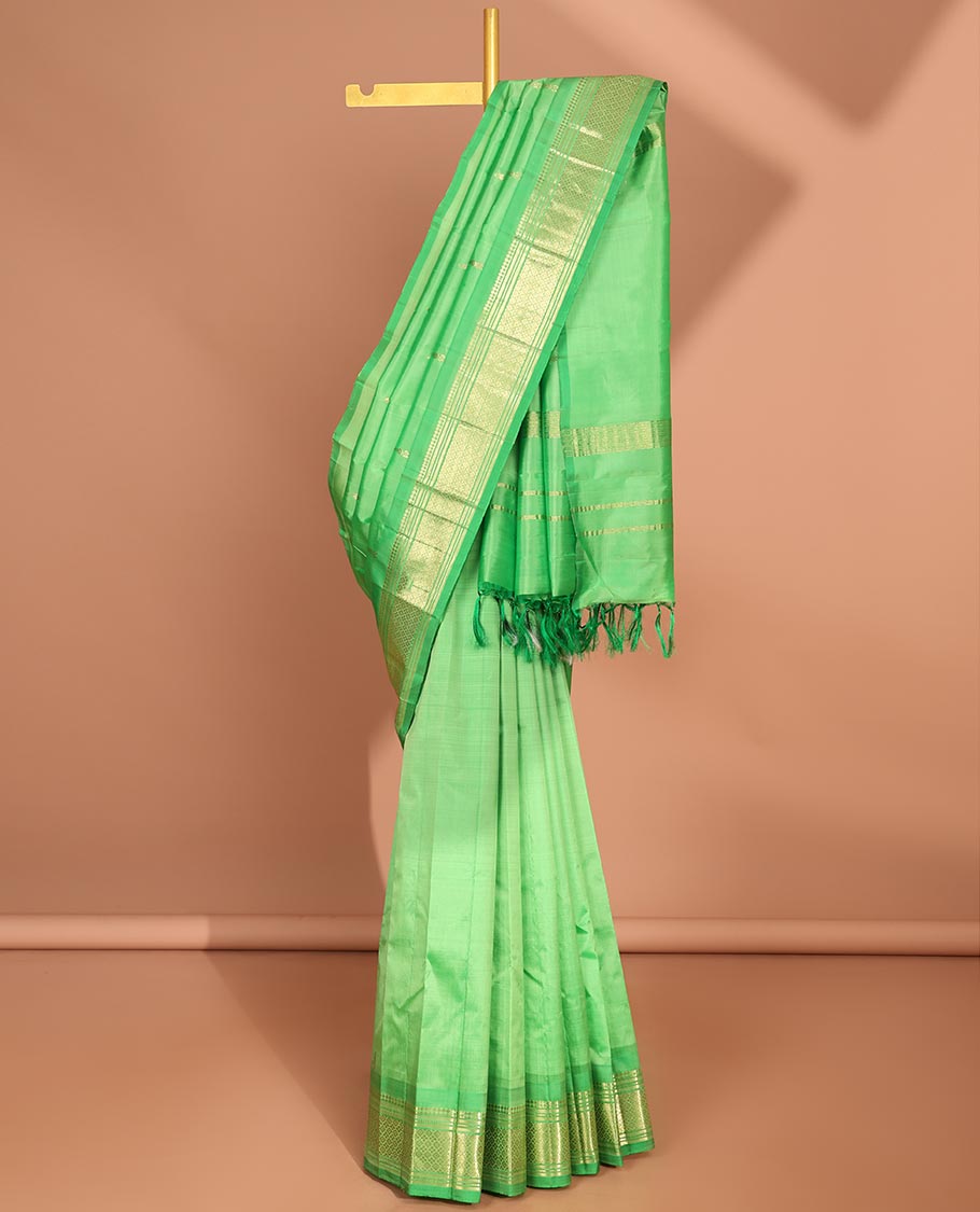 Green  floral buttas kancheepuram silk saree with contrast border of sombu,banaras, muthu, jaal design & zari design pallu